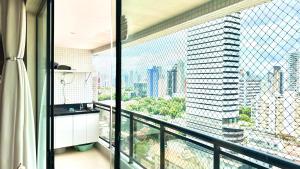 a balcony with a view of a tall building at Umarizal in Belém