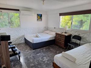 A bed or beds in a room at Casa Breizh