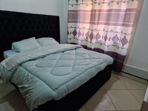 Postel nebo postele na pokoji v ubytování EKA homes