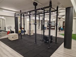 a gym with a bunch of equipment in a room at Sport Hotel Kantri in Kankaanpää