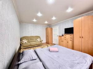 Postel nebo postele na pokoji v ubytování В центре Павлодара светлая квартира