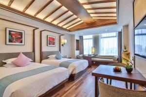 Ένα ή περισσότερα κρεβάτια σε δωμάτιο στο SSAW Boutique Hotel Hangzhou Qianjiang New City +64 φωτογραφίες