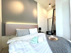 Postel nebo postele na pokoji v ubytování Cozy Tamarind Suites