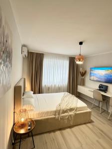 Ένα ή περισσότερα κρεβάτια σε δωμάτιο στο Monique's apartament 2