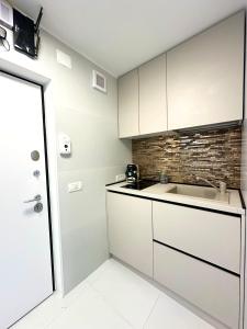 Η κουζίνα ή μικρή κουζίνα στο Monique's apartament 2