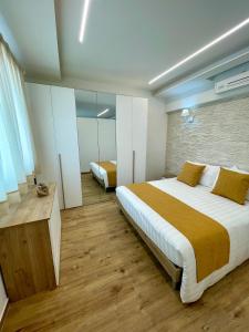 a bedroom with a large bed and a mirror at VITA Residence in Castelvetro Piacentino +14 photos