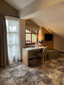TV a/nebo společenská místnost v ubytování Appartment-Hotel-Hölzl