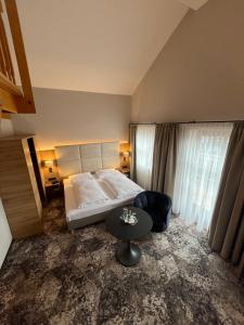 Postel nebo postele na pokoji v ubytování Appartment-Hotel-Hölzl