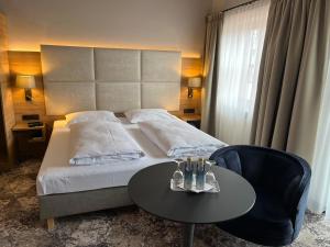 Postel nebo postele na pokoji v ubytování Appartment-Hotel-Hölzl