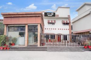 a building with a gate in front of it at Super Hotel O Tyagi Road near Railway Station in Dehradun