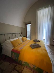 A bed or beds in a room at Masseria I Raffi b&b Még 37 kép