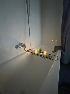 a couple of candles sitting on a shelf in a room at Schönes 4-Zimmer Appartment, WLAN, Küche, BAD in Ilmenau +18 photos
