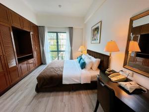Postel nebo postele na pokoji v ubytování Diamond Westlake Suites