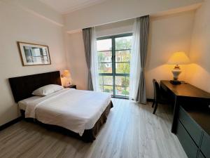 Postel nebo postele na pokoji v ubytování Diamond Westlake Suites