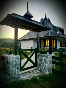 a house with a gate in front of it at Casa Mila Zlatibor in Zlatibor