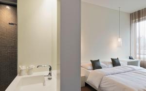 Letto o letti in una camera di Trafo Hotel Baden