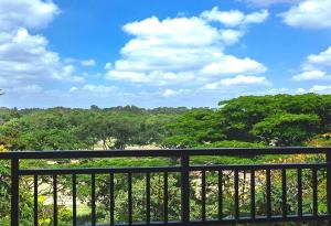 a view from the balcony of a resort with trees at Palani Andavar in Bangalore