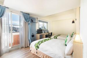 Postel nebo postele na pokoji v ubytování Liga Hotel