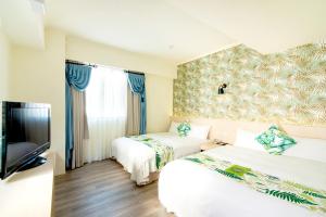 Postel nebo postele na pokoji v ubytování Liga Hotel
