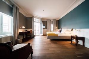 Postel nebo postele na pokoji v ubytování Blue City Boutique Hotel