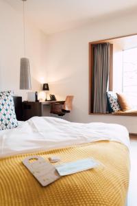 Postel nebo postele na pokoji v ubytování Blue City Boutique Hotel
