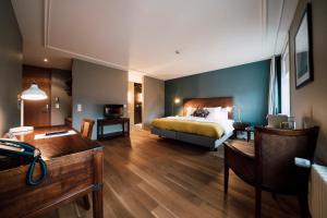 Postel nebo postele na pokoji v ubytování Blue City Boutique Hotel