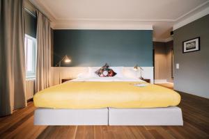 Postel nebo postele na pokoji v ubytování Blue City Boutique Hotel