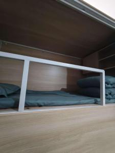 Letto o letti in una camera di 百灿青年客栈新国际博览中心店