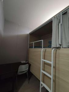 Letto o letti in una camera di 百灿青年客栈新国际博览中心店