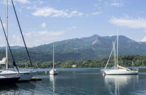 a group of boats sitting in the water at b&b al lago Mady in Avigliana
