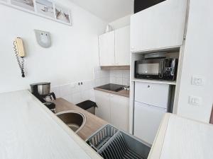 Køkken eller tekøkken på Maison Domaine du Golf de Pierre et Vacances + 18 billeder