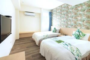 Postel nebo postele na pokoji v ubytování Liga Hotel