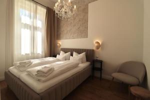 Postel nebo postele na pokoji v ubytování Apartmá Hilda 1905