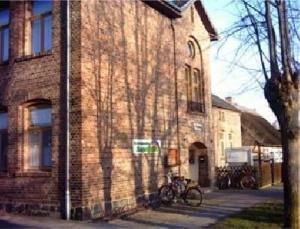 a brick building with bikes parked in front of it at Appartement In Meiersberg Mit Grill in Grambin