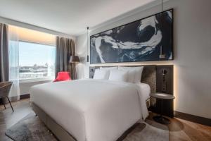 A bed or beds in a room at Radisson Collection Hotel, Tallinn
