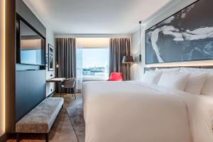 A bed or beds in a room at Radisson Collection Hotel, Tallinn