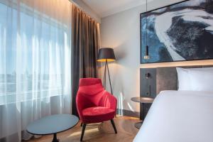 A bed or beds in a room at Radisson Collection Hotel, Tallinn