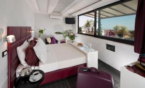 Postel nebo postele na pokoji v ubytování Hotel Gabriella