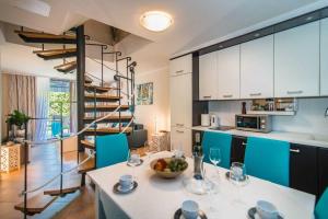 a kitchen with a table with a bowl of fruit on it at Villa Maklavun by Kompas Villas in Kanfanar