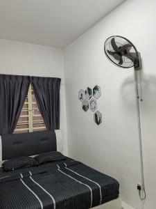 Postel nebo postele na pokoji v ubytování ZE VI Homestay,Tanah Rata