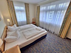 Ein Bett oder Betten in einem Zimmer der Unterkunft Ferienwohnung 3 26 Inselstrand