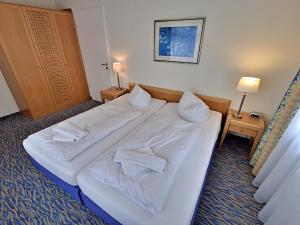 Ein Bett oder Betten in einem Zimmer der Unterkunft Ferienwohnung 3 26 Inselstrand