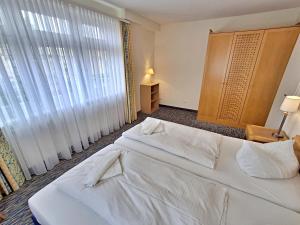 Ein Bett oder Betten in einem Zimmer der Unterkunft Ferienwohnung 3 26 Inselstrand