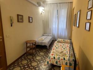 En eller flere senge i et værelse på Oasi nel Cuore di Lucca, super centrale e luminoso