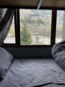 Voodi või voodid majutusasutuse MountRush Adventures Manali toas