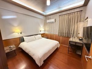 TV a/nebo společenská místnost v ubytování One Fukun Hotel