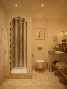 a bathroom with a shower and a toilet and a sink at Hôtel Maison Chiberta I Ouverture été 2025 in Anglet