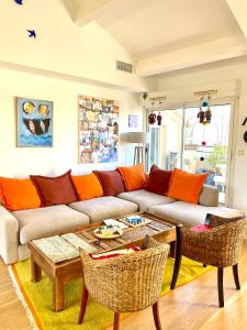 a living room with a couch and a table at Prado Spacious and Sunny Loft in Marseille in Marseille