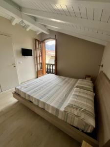 Postel nebo postele na pokoji v ubytování B&B Aria Di Lago