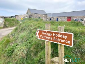 a sign for a tobacco hudbey colleges entrance at Ty Bedwen - Cosy Rural Retreat in St Davids in St. Davids